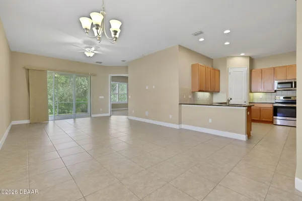 a view of a kitchen with a sink and cabinets