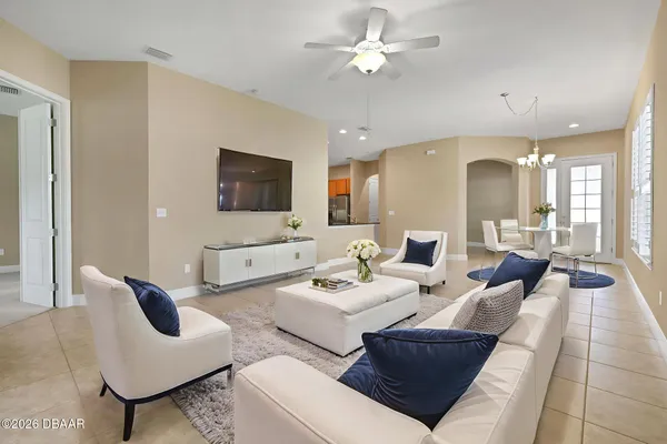 a living room with furniture and a flat screen tv
