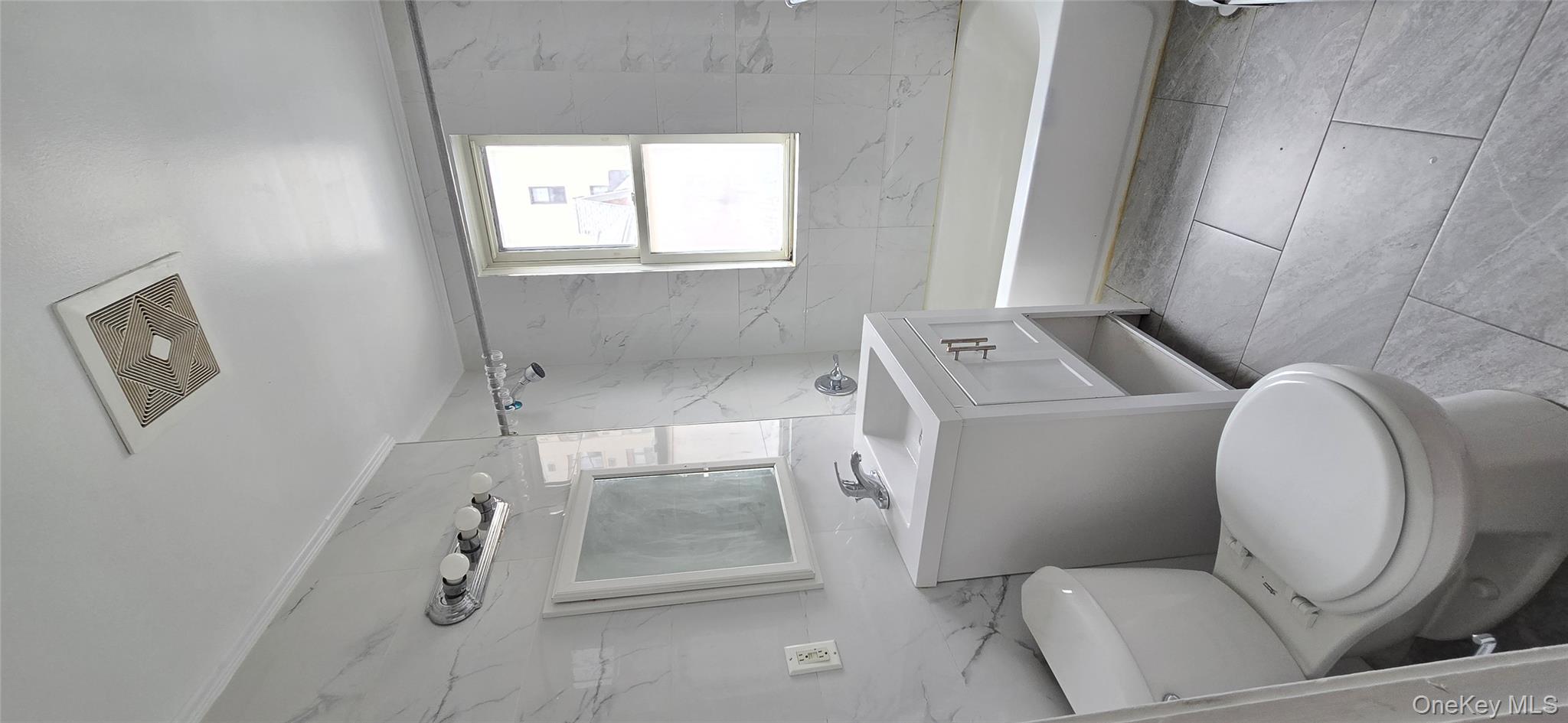 46-07 79th Street Queens, NY 11373 - Photo 11 of 13 a bathroom with a sink a toilet and a bathtub