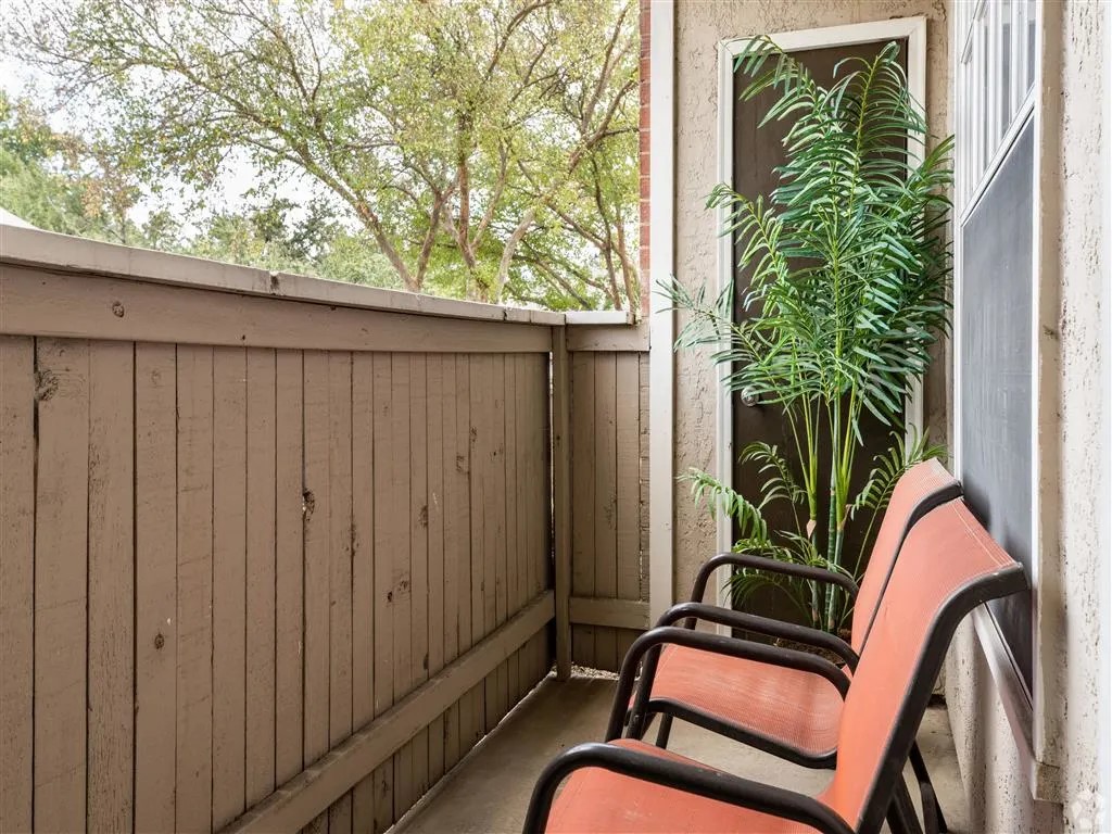 7610 Cameron Road, Unit 2095 Austin, TX 78752 - Photo 16 of 42 a view of a backyard with a chair and a potted plant