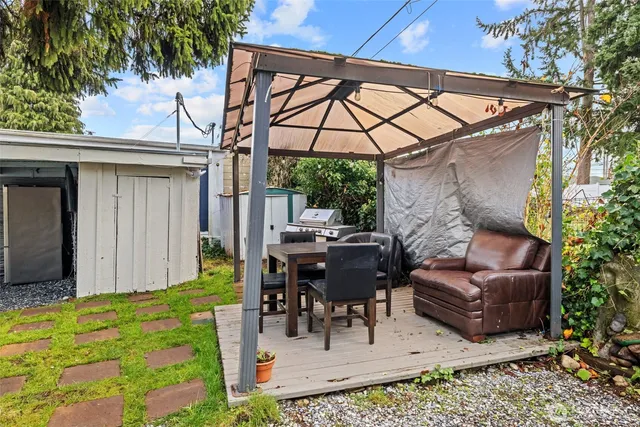 a view of yard with patio