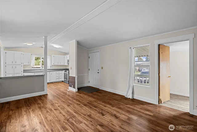 a view of kitchen with wooden floor