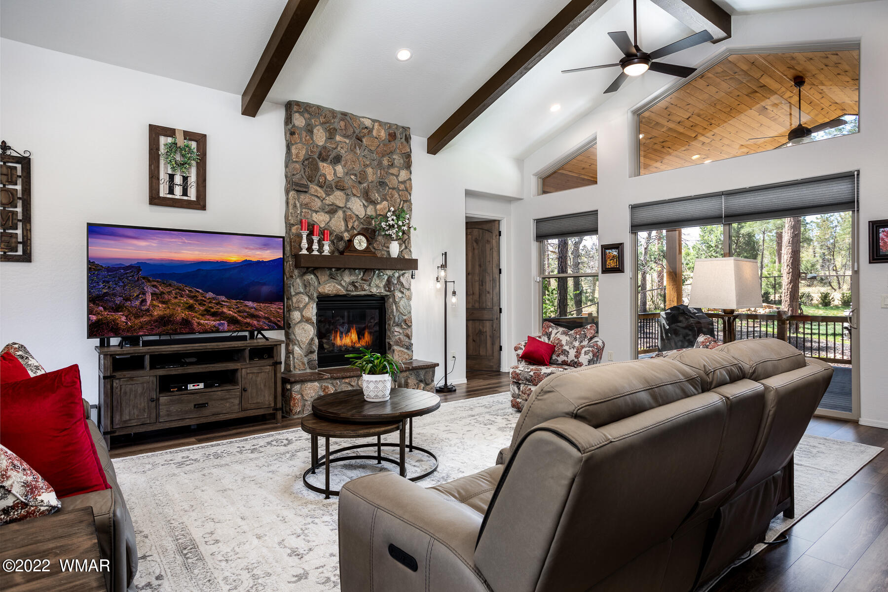 1950 Silver Tree Lane Show Low, AZ 85901 - Photo 12 of 41 a living room with furniture a fireplace and a flat screen tv