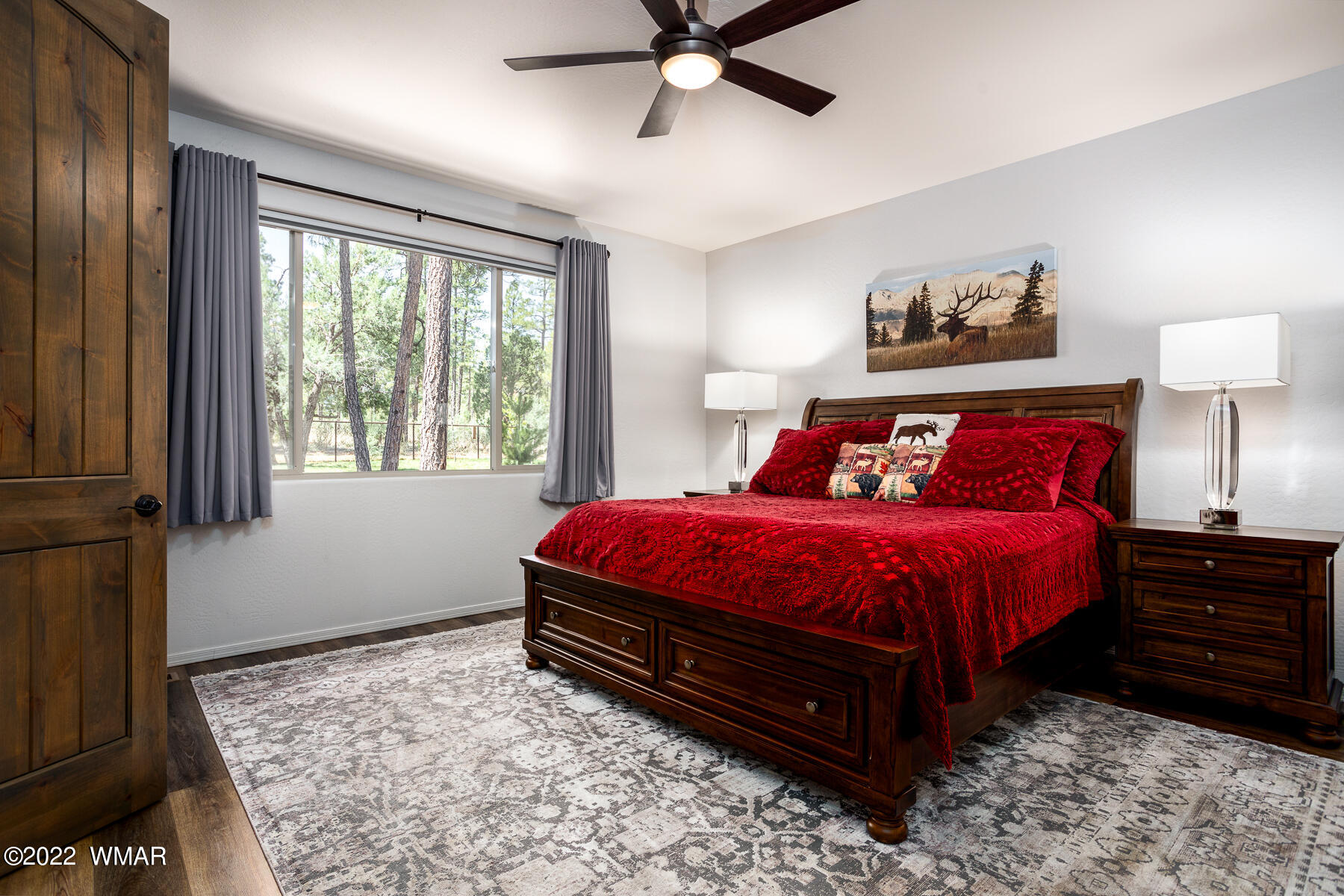 1950 Silver Tree Lane Show Low, AZ 85901 - Photo 19 of 41 a spacious bedroom with a bed and a window