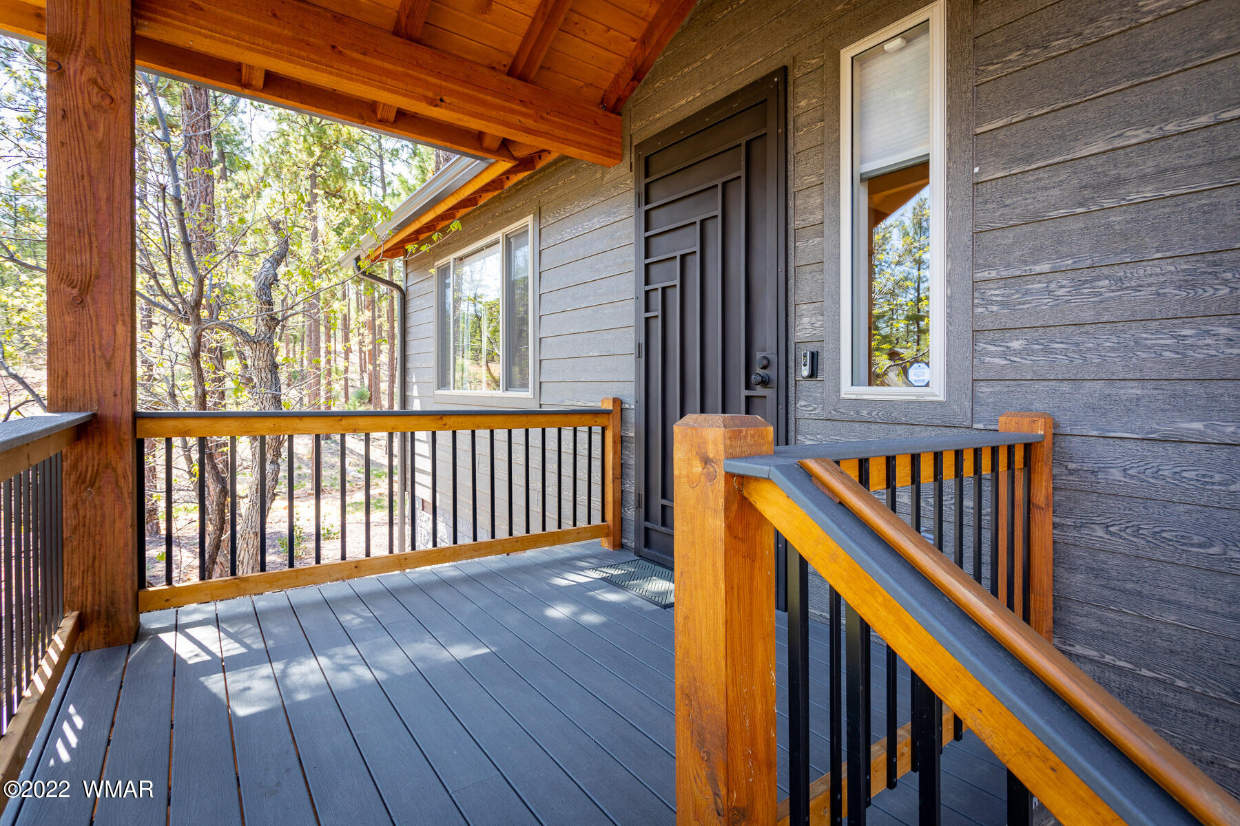 1950 Silver Tree Lane Show Low, AZ 85901 - Photo 10 of 41 a view of a wooden balcony with a yard