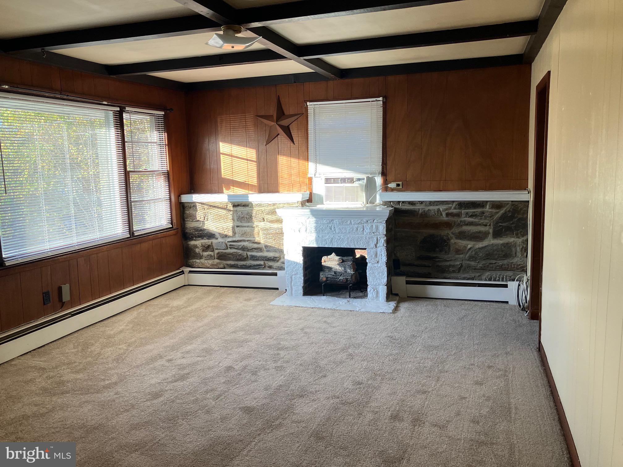 1028 Mantua Pike, Unit D Wenonah, NJ 08090 - Photo 2 of 10 a view of empty room with a fireplace and window