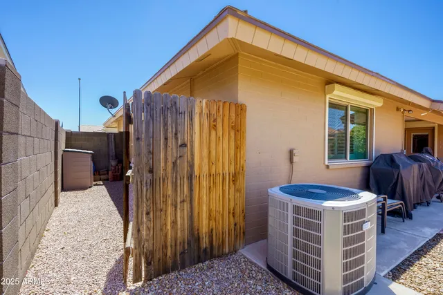 a view of backyard with tub and outdoor seating