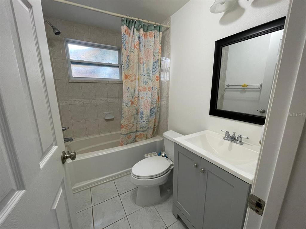 6314 Seabreeze Drive Port Richey, FL 34668 - Photo 19 of 46 a bathroom with a sink a toilet and shower