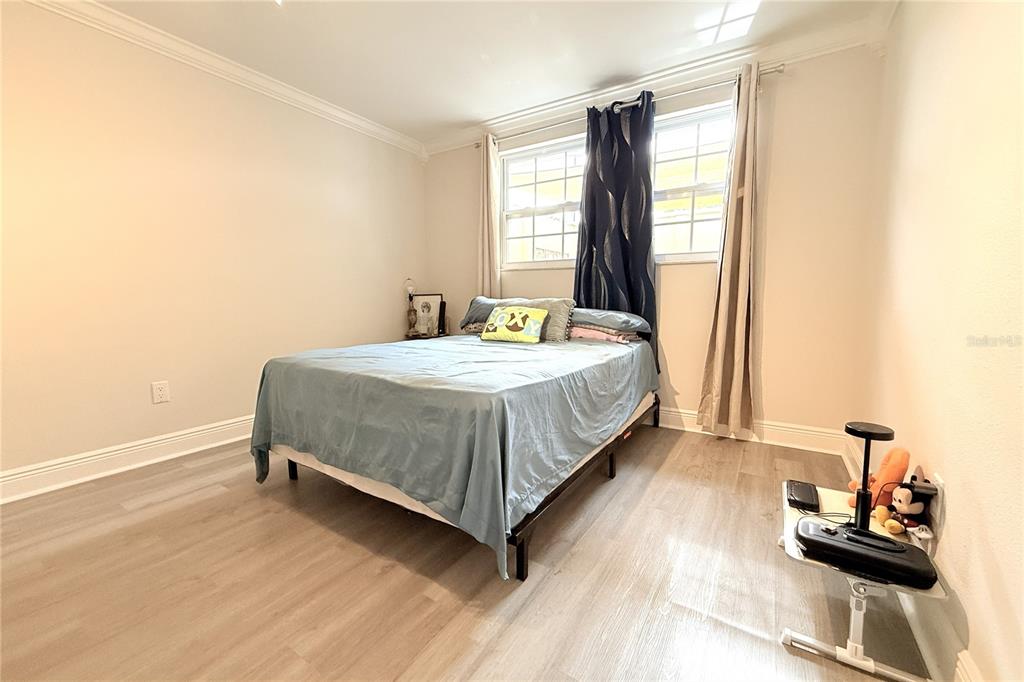 6314 Seabreeze Drive Port Richey, FL 34668 - Photo 23 of 46 a bedroom with a bed and window