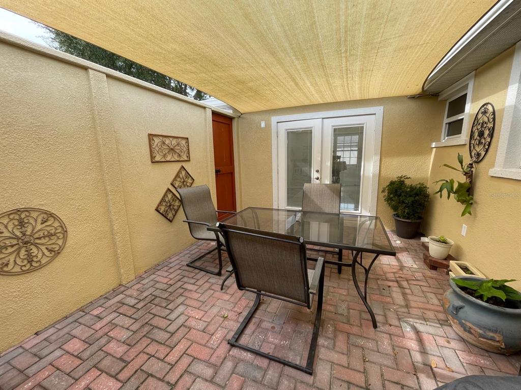 6314 Seabreeze Drive Port Richey, FL 34668 - Photo 26 of 46 a view of a patio with table and chairs