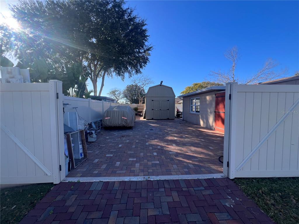 6314 Seabreeze Drive Port Richey, FL 34668 - Photo 33 of 46 a view of a backyard with furniture and trees