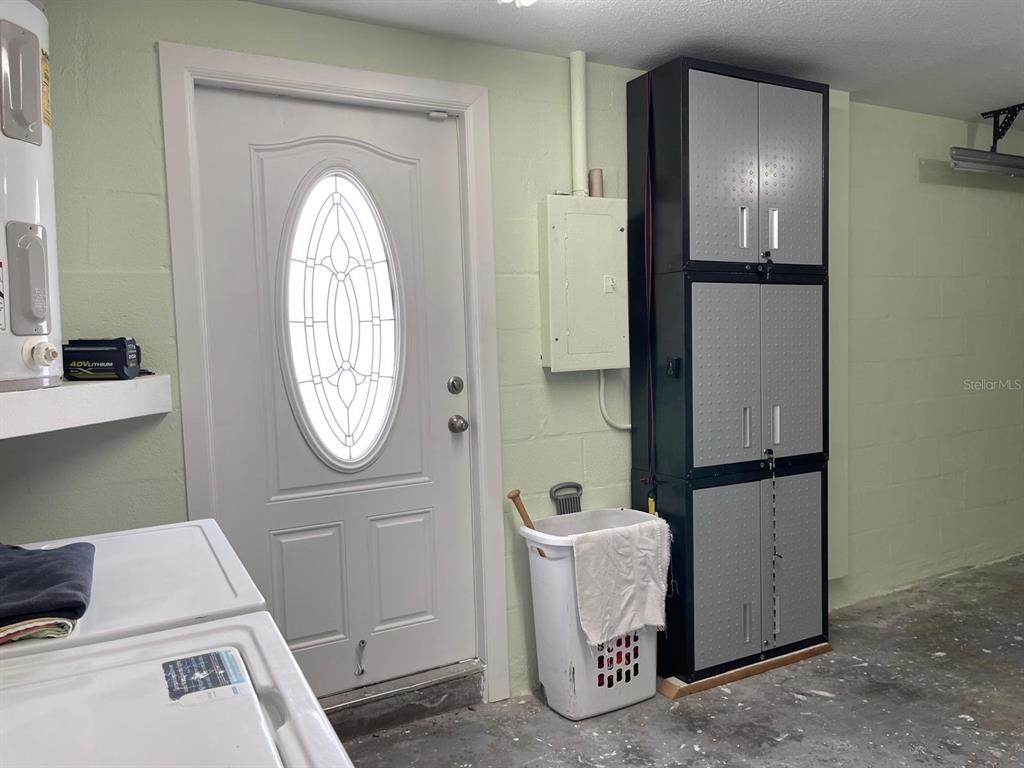 6314 Seabreeze Drive Port Richey, FL 34668 - Photo 38 of 46 a room with a washer and dryer