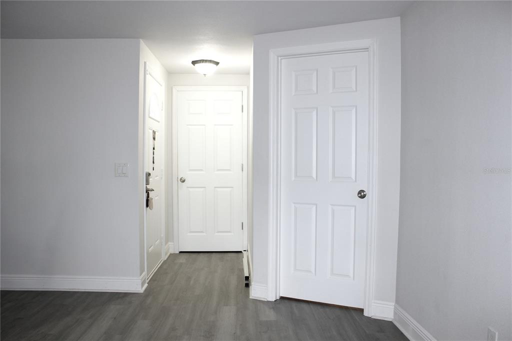 6314 Seabreeze Drive Port Richey, FL 34668 - Photo 6 of 46 an empty room with wooden floor