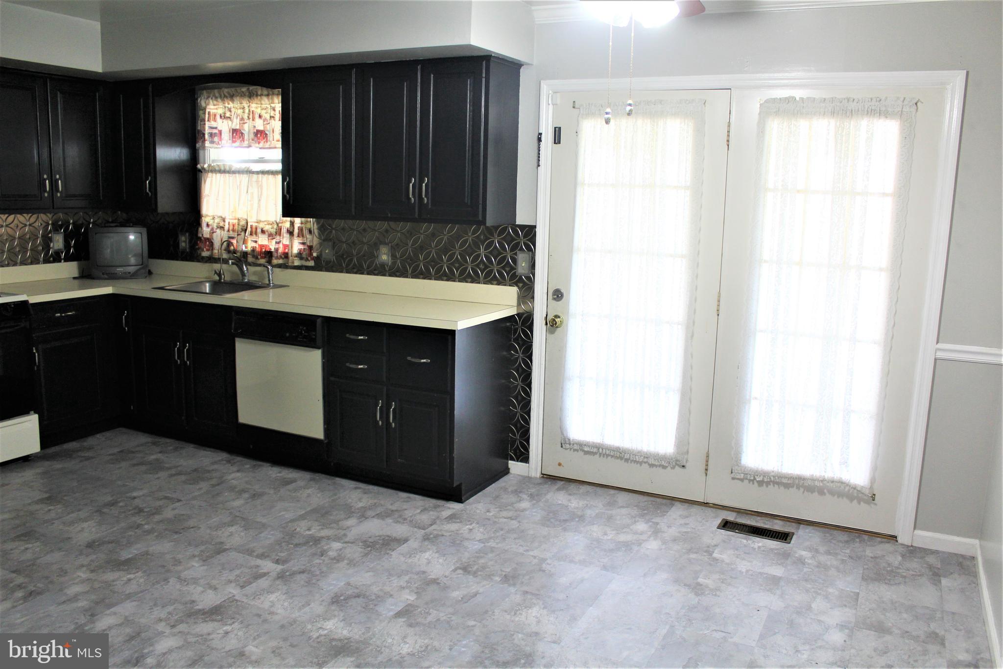 4335 Stoudts Ferry Bridge Road Reading, PA 19605 - Photo 9 of 29 KITCHEN WITH DINING AREA ON RIGHT