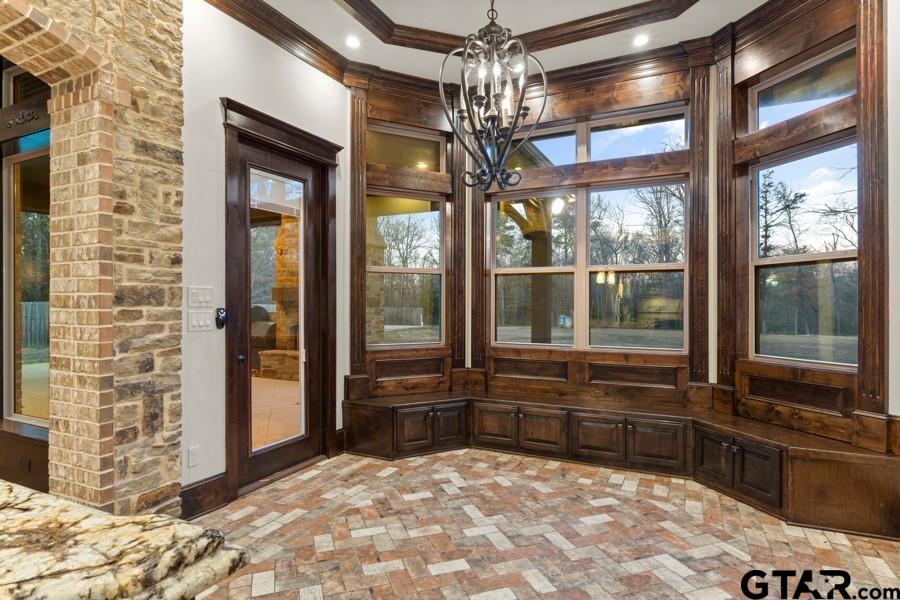 11378 Highway 110 Tyler, TX 75704 - Photo 22 of 42 a room with window and a chandelier