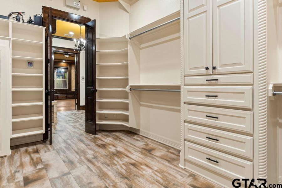 11378 Highway 110 Tyler, TX 75704 - Photo 28 of 42 a view of walk in closet with empty racks