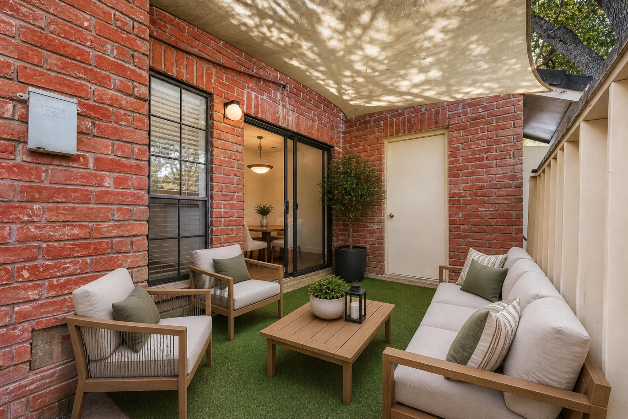 2211 South Kirkwood Road, Unit 68 Houston, TX 77077 - Photo 14 of 14 “Private, enclosed patio with charming brick walls and a cozy courtyard feel—perfect for relaxing, entertaining, or enjoying outdoor dining in a low-maintenance setting.”