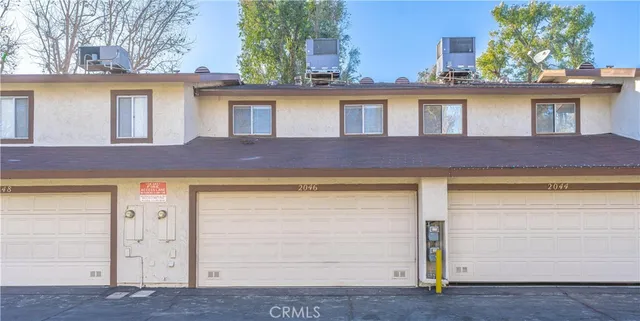a front view of a house with garage
