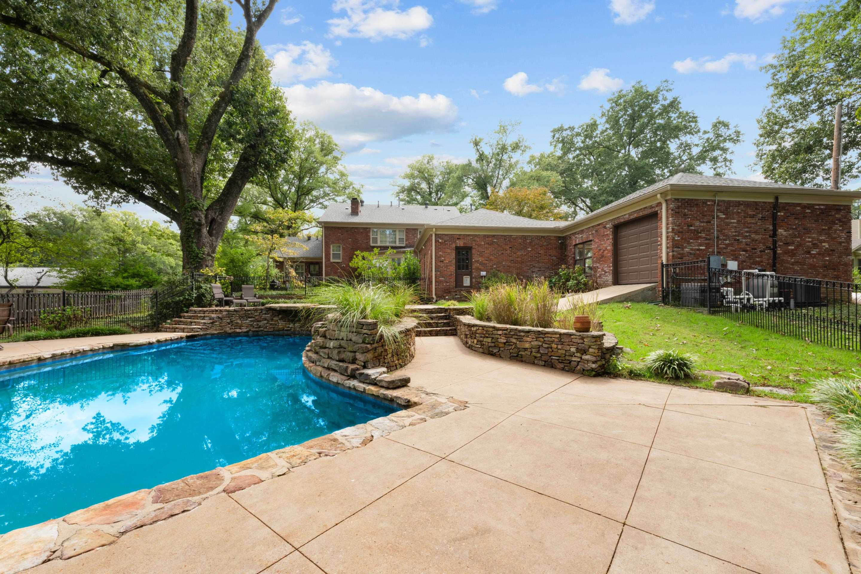 5360 Normandy Road Memphis, TN 38120 - Photo 7 of 40 a view of a house with backyard garden and sitting area