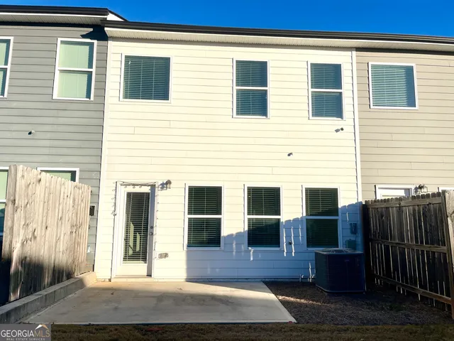 a view of front door of house and wooden