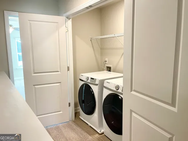 a utility room with dryer and washer