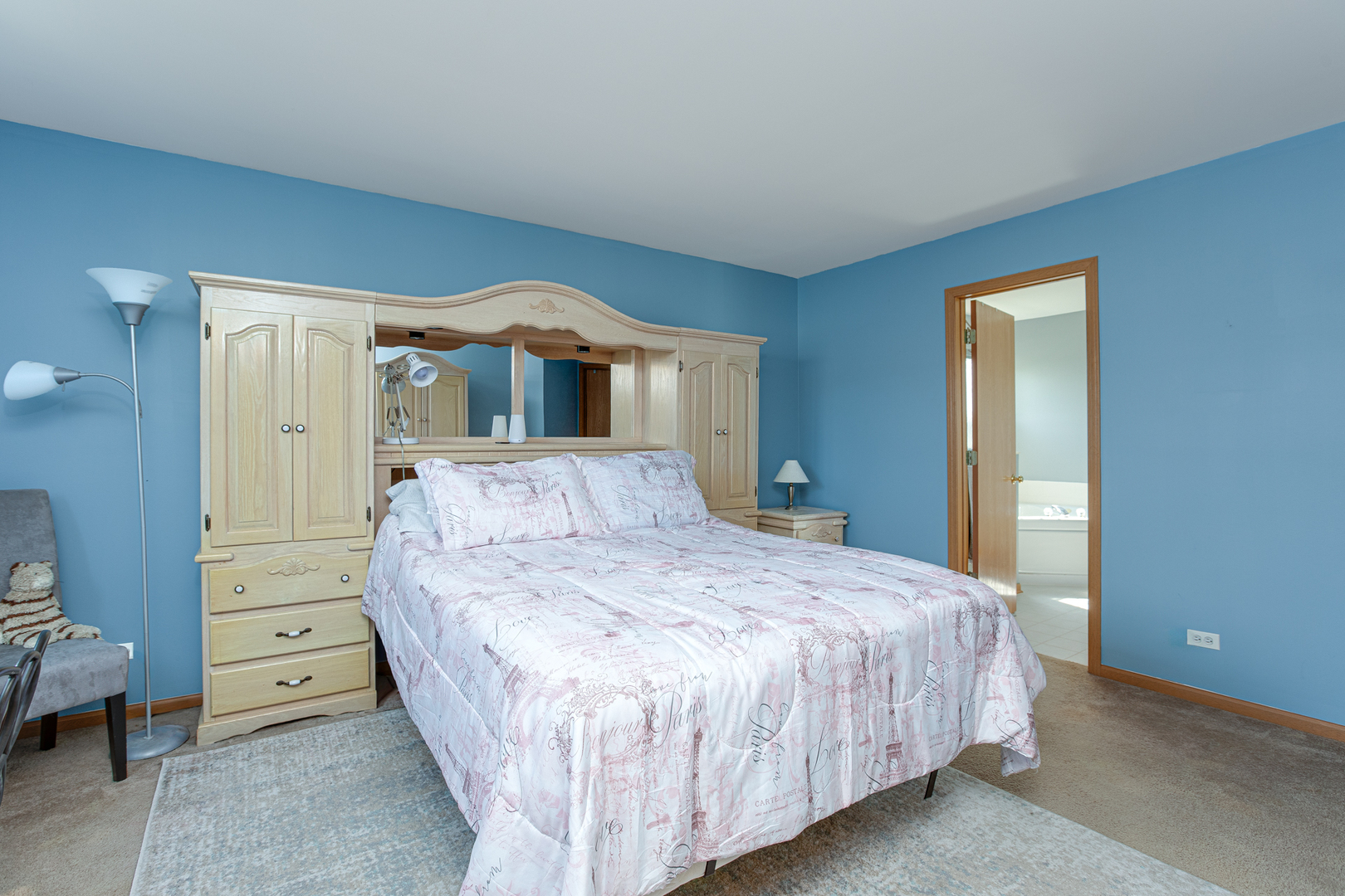206 Brompton Lane, Unit A Sugar Grove, IL 60554 - Photo 12 of 17 a bedroom with a bed and a dresser
