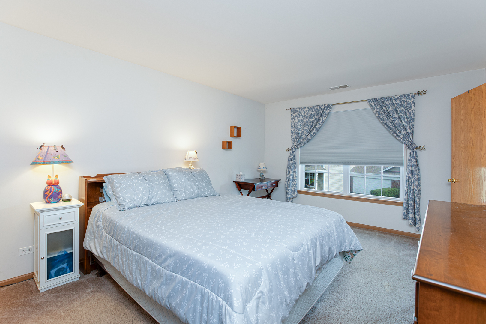 206 Brompton Lane, Unit A Sugar Grove, IL 60554 - Photo 16 of 17 a bedroom with a bed and a large window