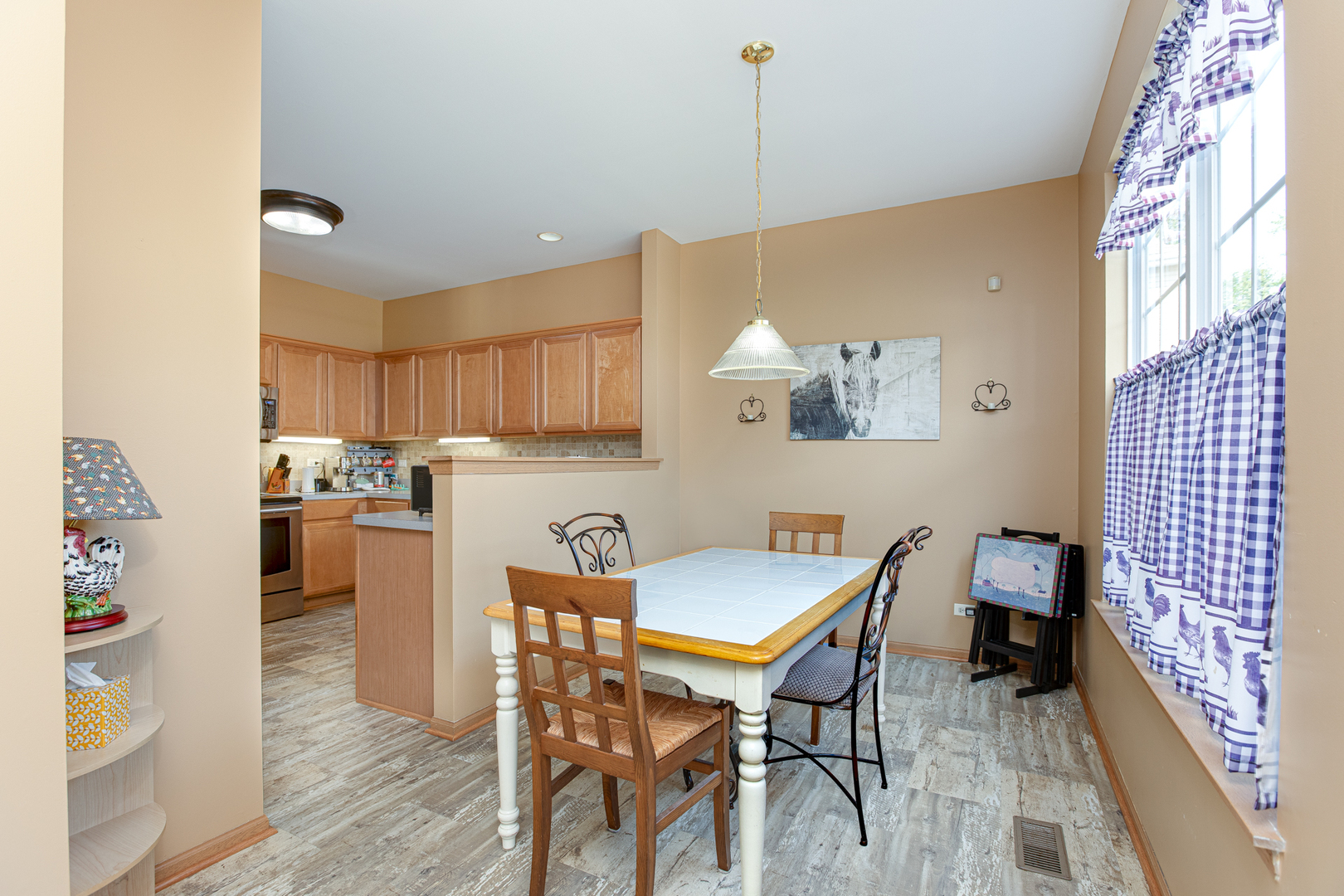 206 Brompton Lane, Unit A Sugar Grove, IL 60554 - Photo 7 of 17 a view of a dining room with furniture and wooden floor