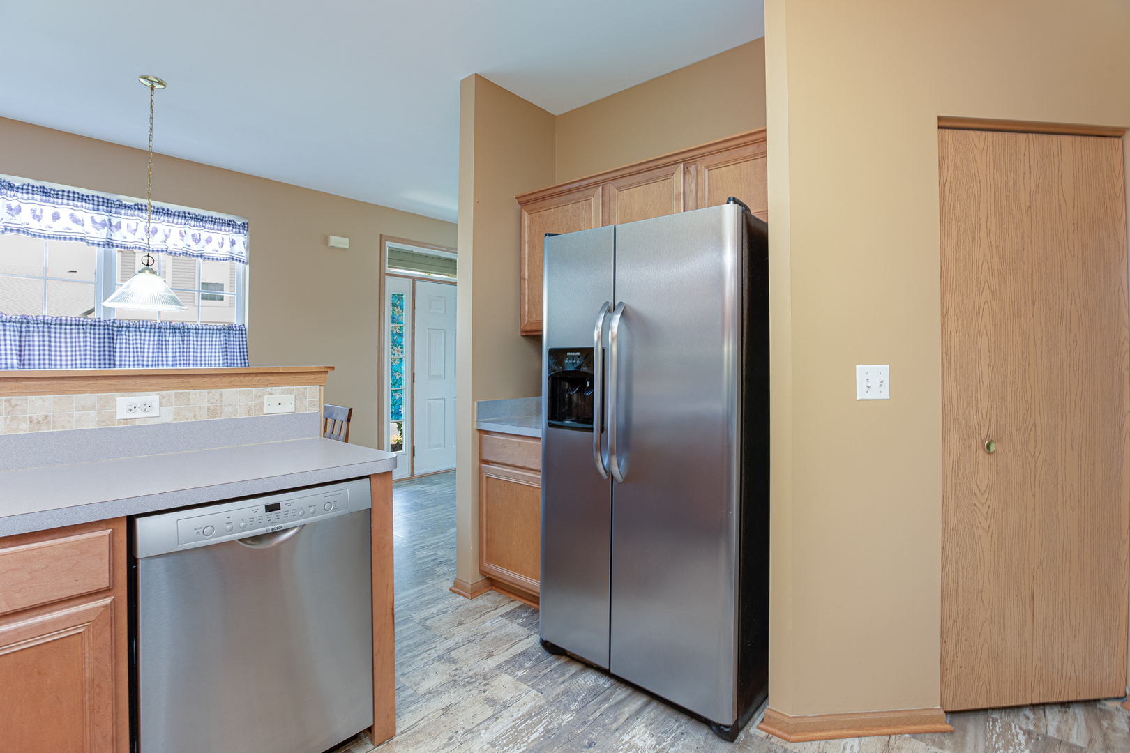 206 Brompton Lane, Unit A Sugar Grove, IL 60554 - Photo 10 of 17 a metallic refrigerator freezer sitting in a kitchen