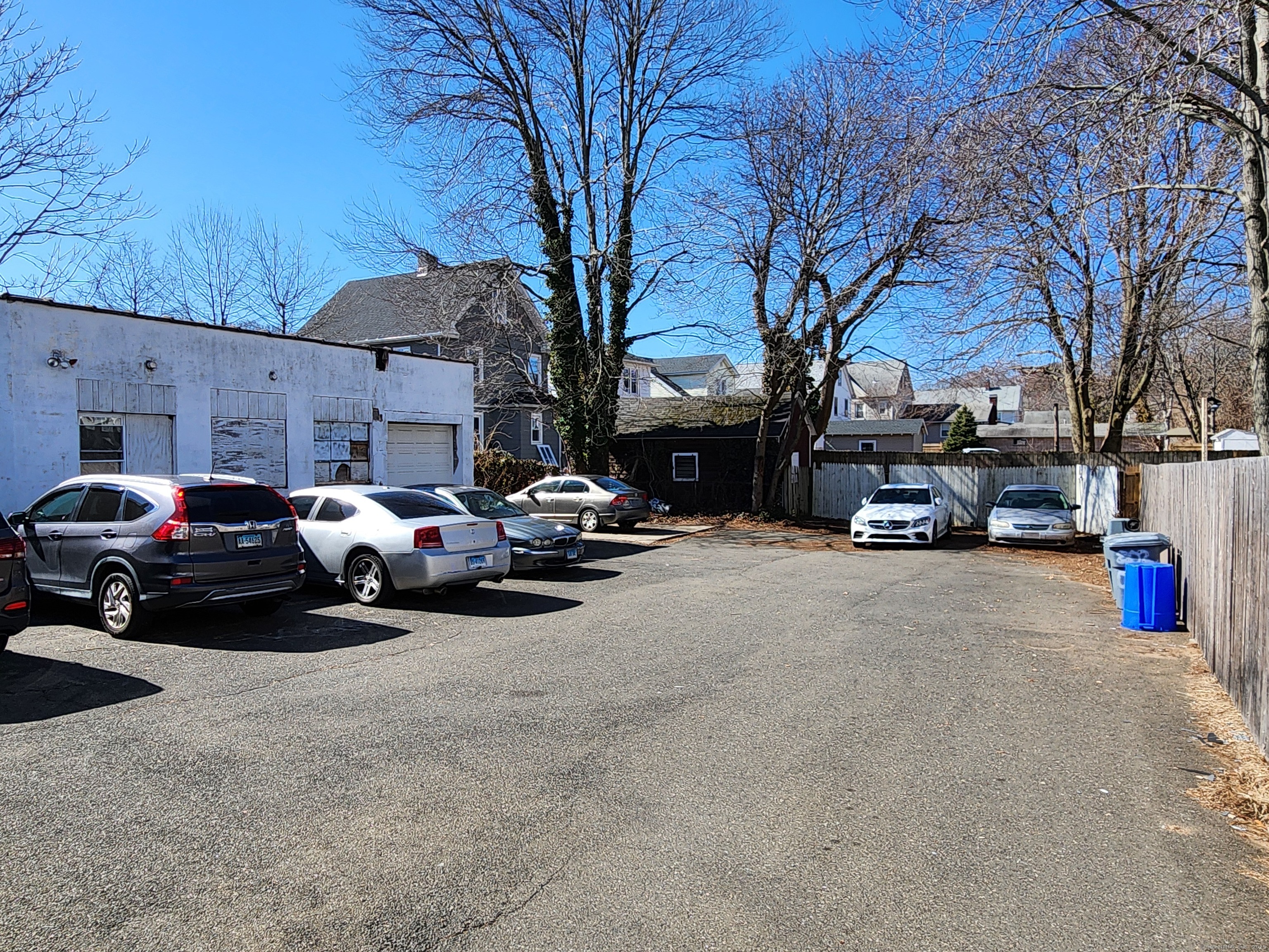 202 Campbell Avenue West Haven, CT 06516 - Photo 5 of 5 a group of cars parked in front of a white house