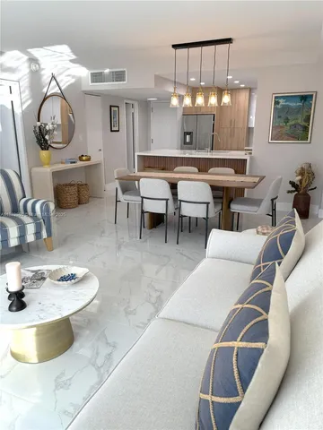 a kitchen with a dining table and chairs