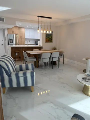 a kitchen with kitchen island stainless steel appliances lots of counter top space