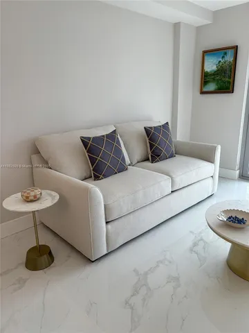 a living room with furniture and a couch