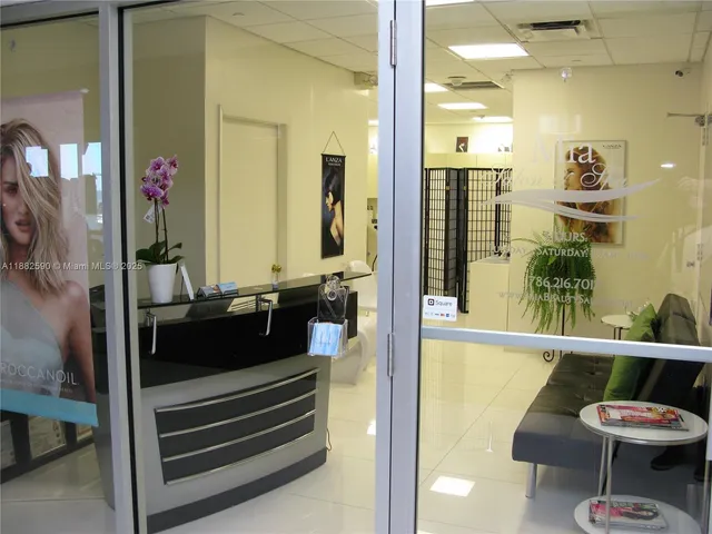 a view of balcony with a potted plant and outdoor seating