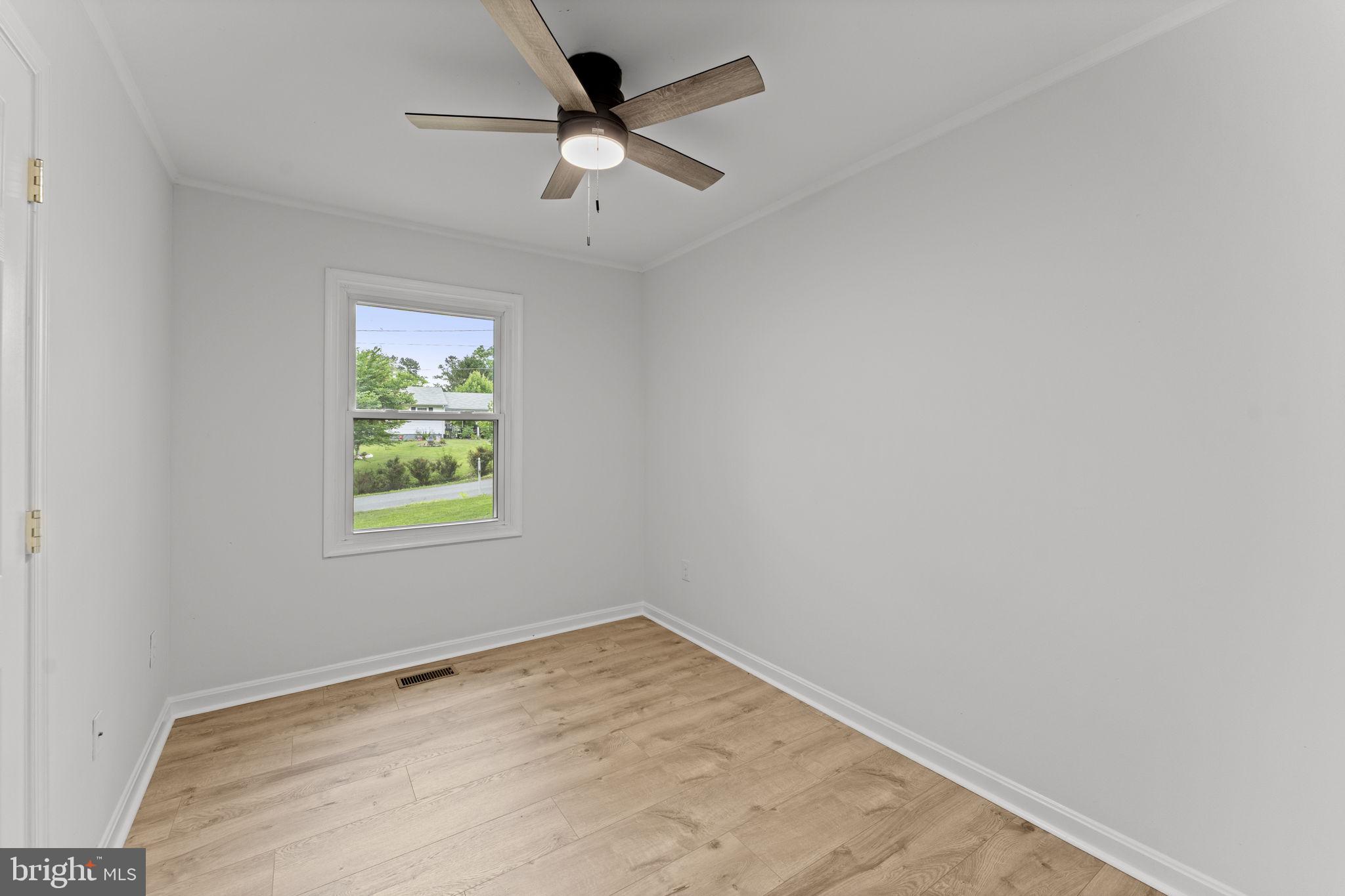 1821 James City Road Reva, VA 22735 - Photo 24 of 44 an empty room with window and ceiling fan