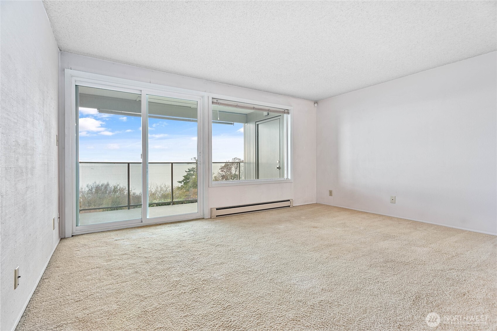 600 South State Street, Unit 208 Bellingham, WA 98225 - Photo 4 of 34 an empty room with wooden floor and windows