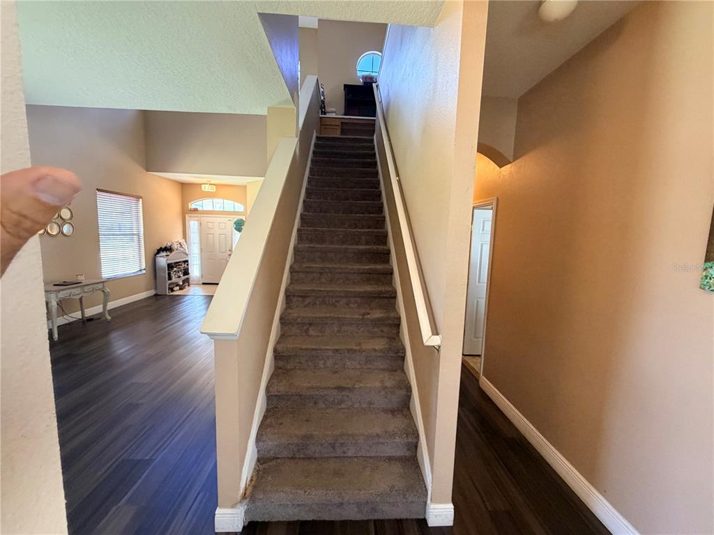 13250 Mandalay Place Spring Hill, FL 34609 - Photo 17 of 28 a view of entryway and hall with wooden floor