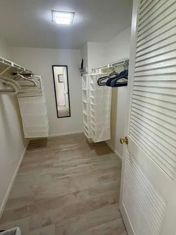 a bedroom with two beds and a table