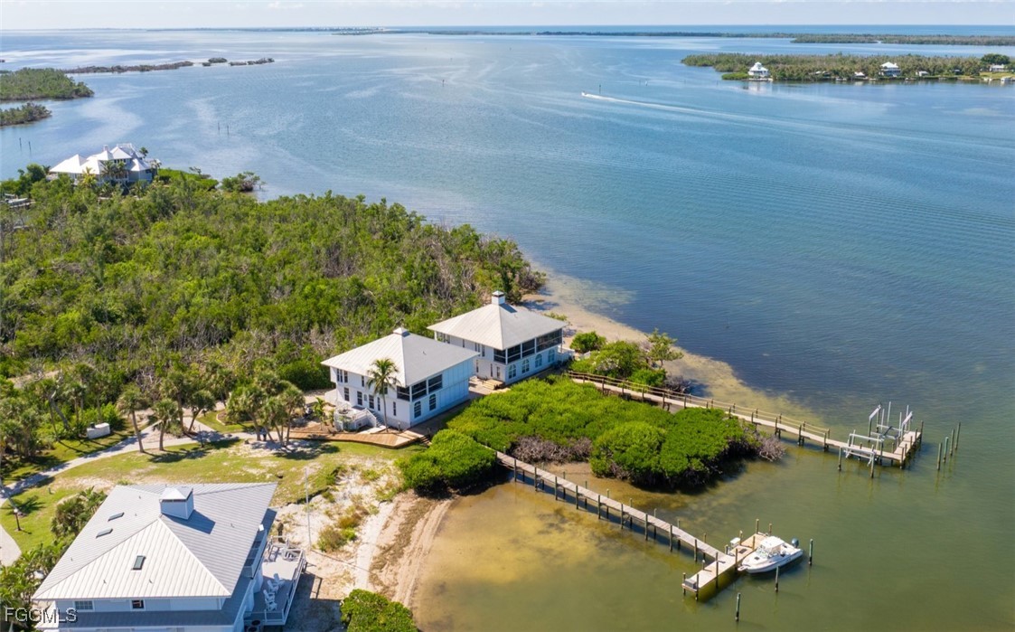 an aerial view of a house with a ocean view