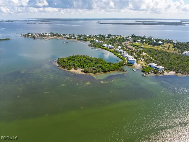 a view of a house with pool and sitting area