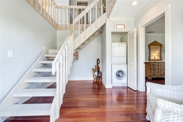 a bedroom with a bed wooden floor and a table