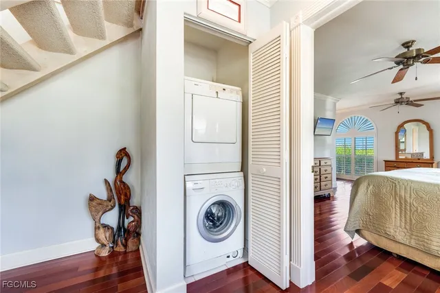 a bedroom with furniture and wooden floor
