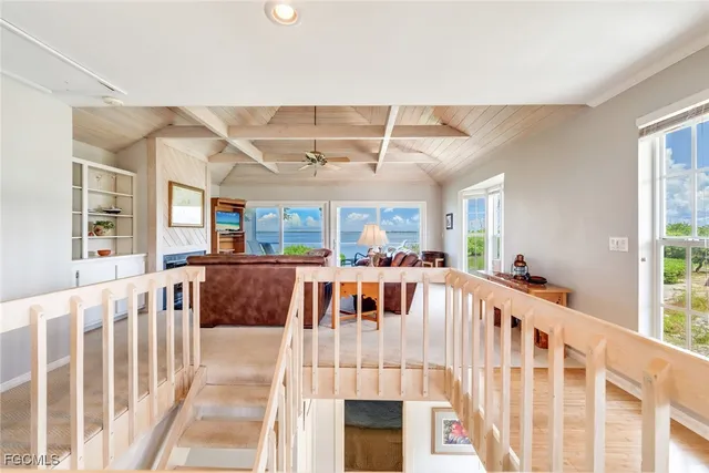 a view of a living room and a floor to ceiling window