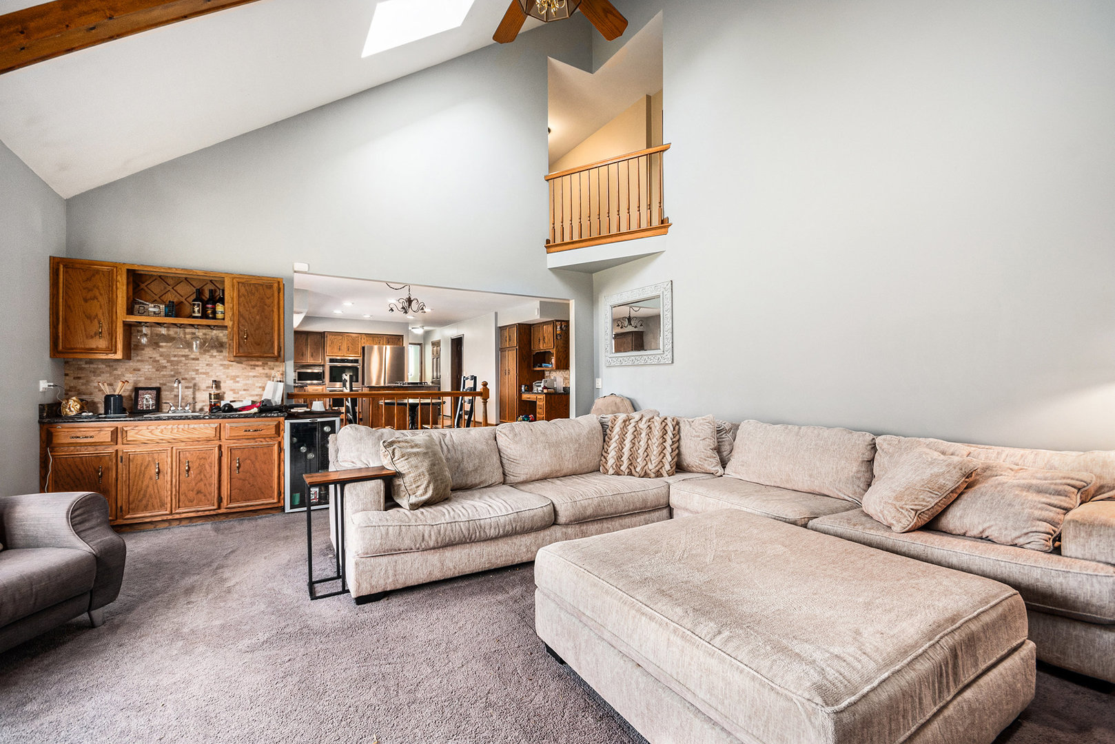 3942 Broadmoor Circle Naperville, IL 60564 - Photo 7 of 25 a living room with furniture and kitchen view
