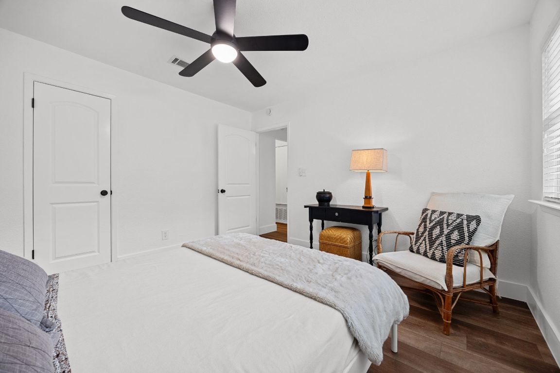 1504 Allen Road, Unit C Austin, TX 78746 - Photo 15 of 26 a bedroom with a bed and wooden floor