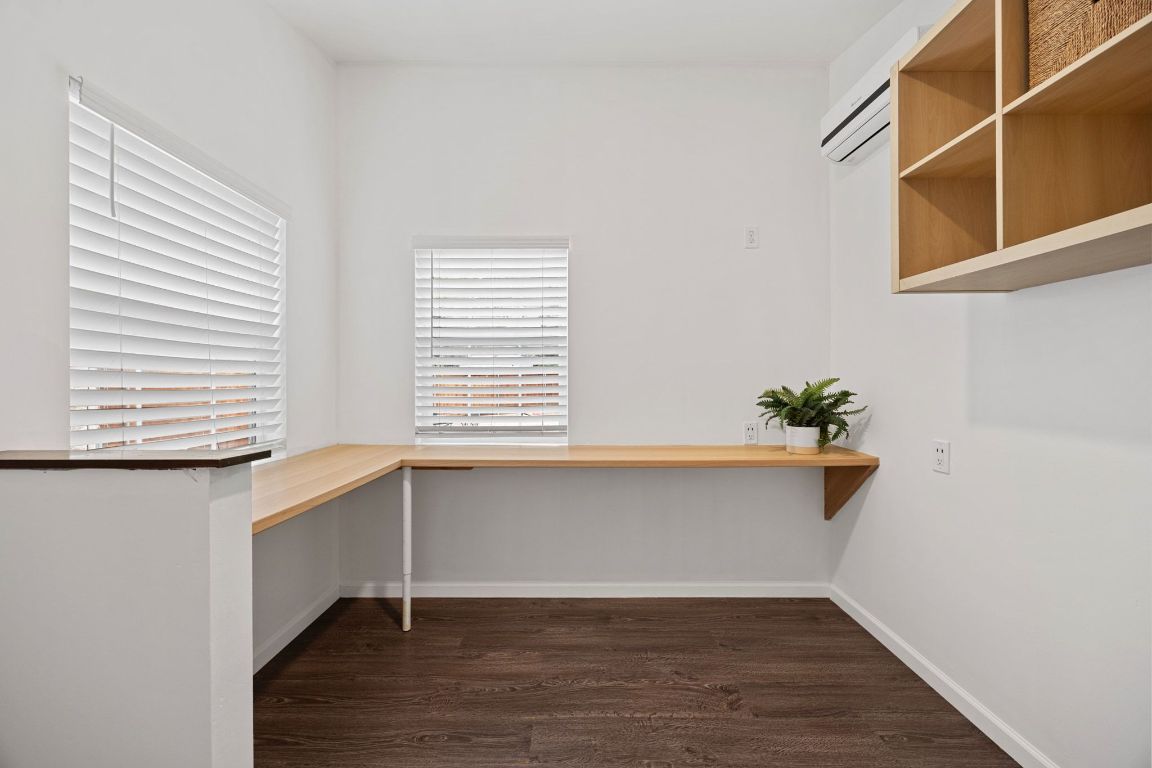 1504 Allen Road, Unit C Austin, TX 78746 - Photo 23 of 26 a view of a kitchen with wooden floor and a window