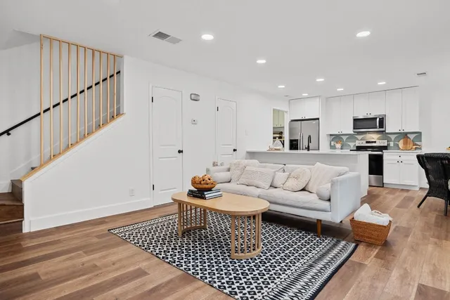 a living room with furniture and a rug