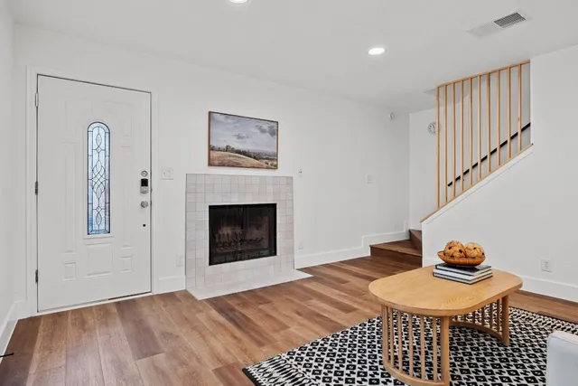a bedroom with a bed and a fireplace