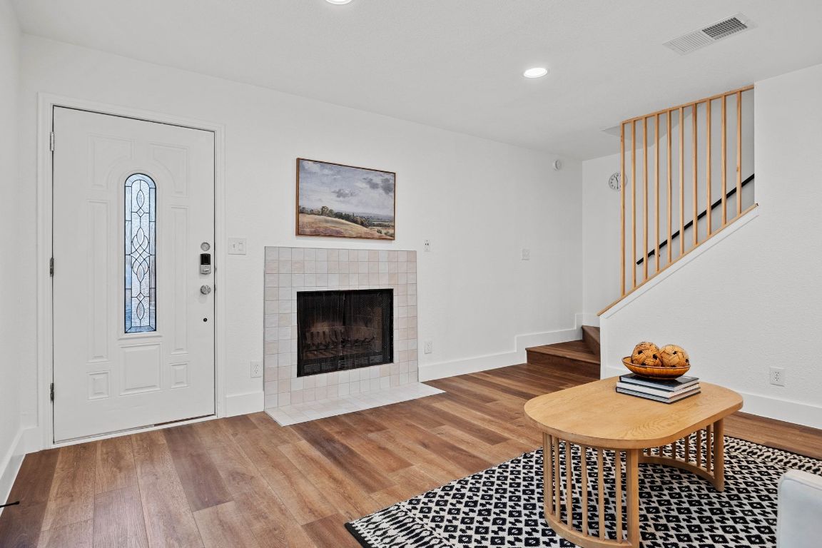 1504 Allen Road, Unit C Austin, TX 78746 - Photo 6 of 26 a bedroom with a bed and a fireplace