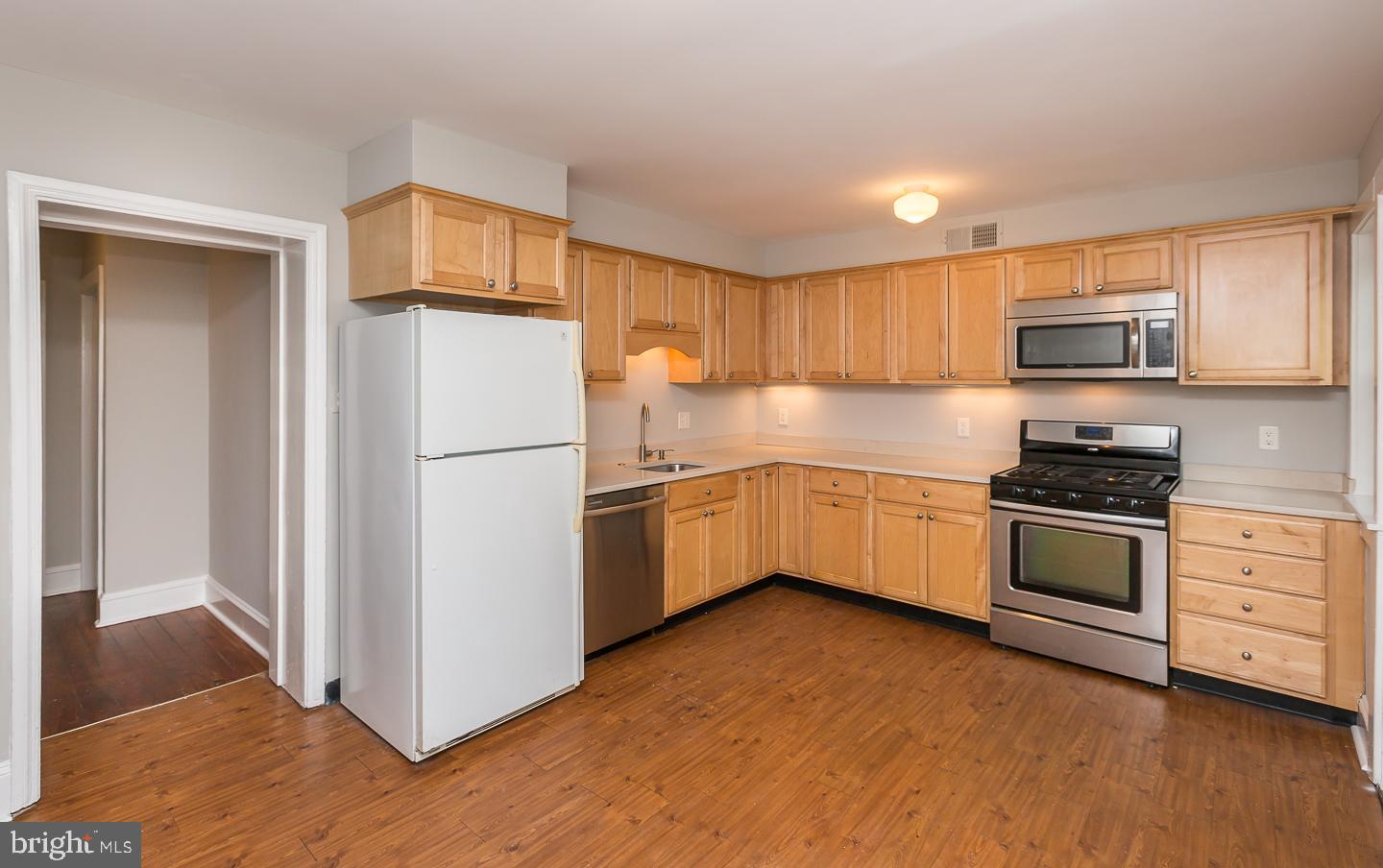 337 Righters Mill Road Gladwyne, PA 19035 - Photo 15 of 41 a kitchen with stainless steel appliances white cabinets and a refrigerator